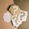 Four posters, each with a question mark in the middle of them