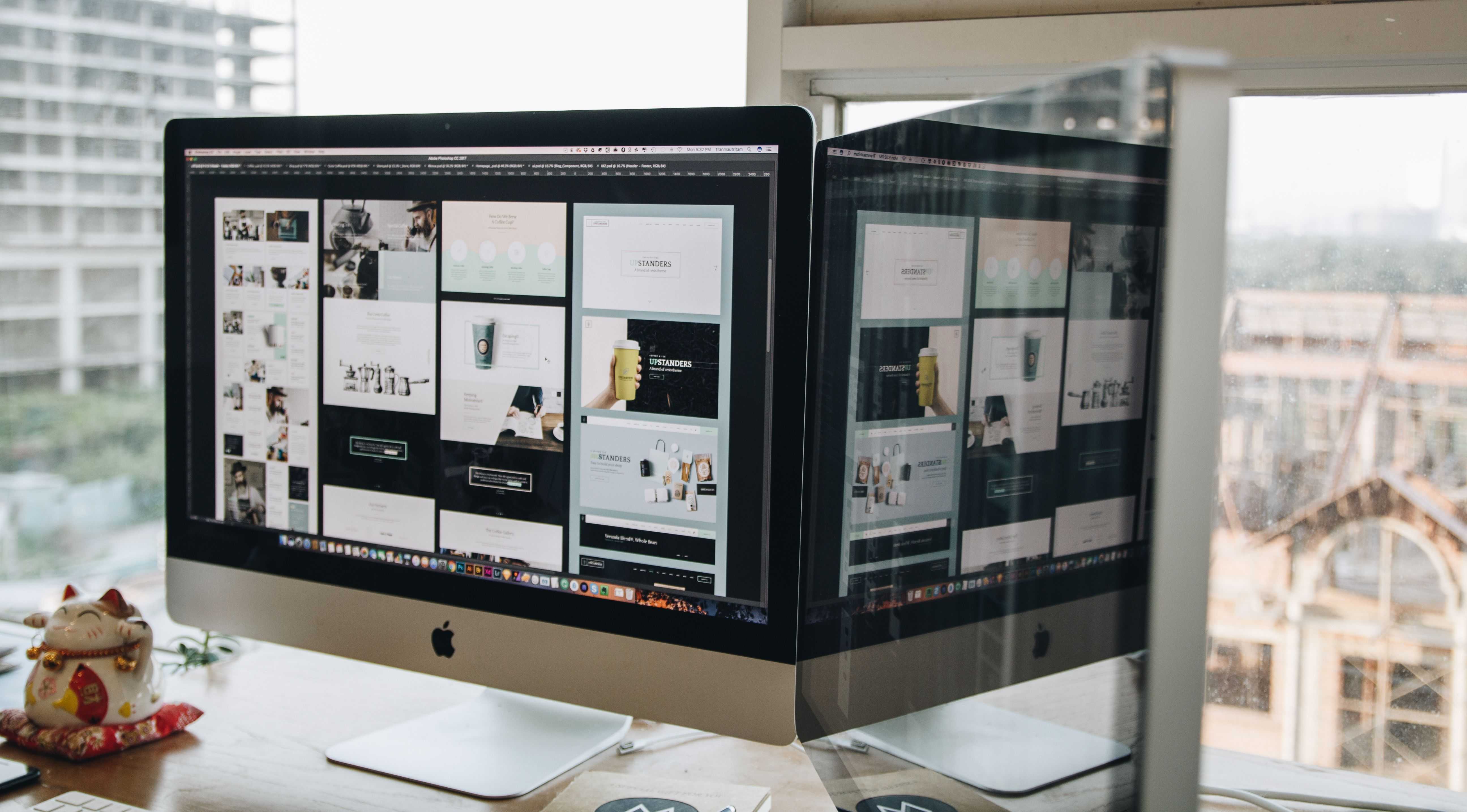A computer monitor displaying different stages of a website's redesign
