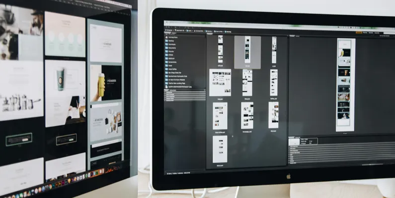 A web design software being displayed on two monitors